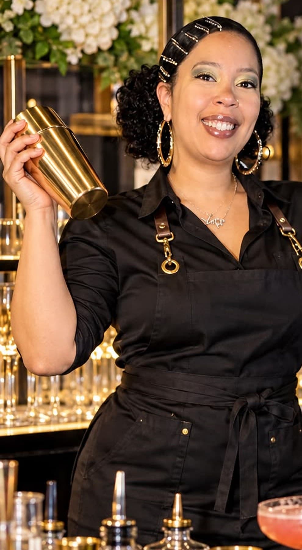 Bartender shaking a cocktail behind an event bar